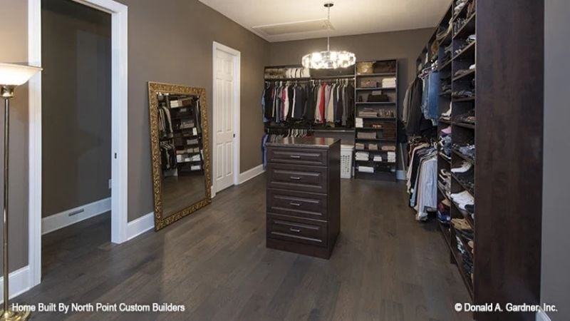 Dark Wood, a Gold Mirror, and Drawer Hardware That Doesn't Apologize