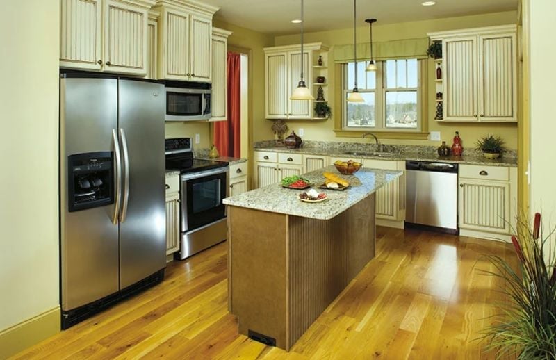 Beadboard Cabinets and a Granite Island That Actually Earn Their Keep