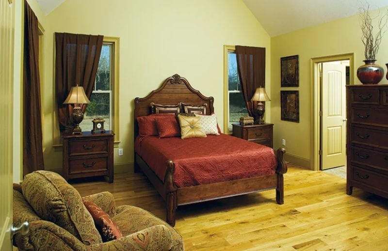 Carved Headboard and Crimson Bedding That Mean Business