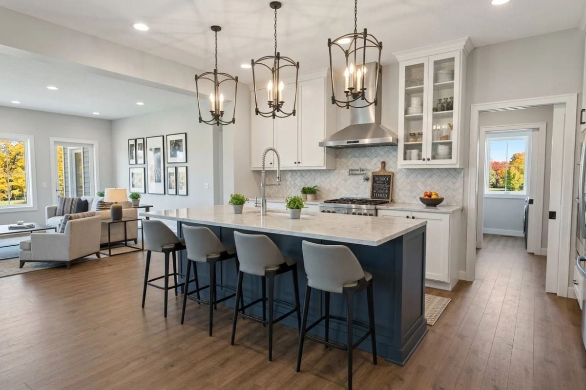 Navy Island with Marble Countertop Anchors an Open Kitchen Built to Gather Around