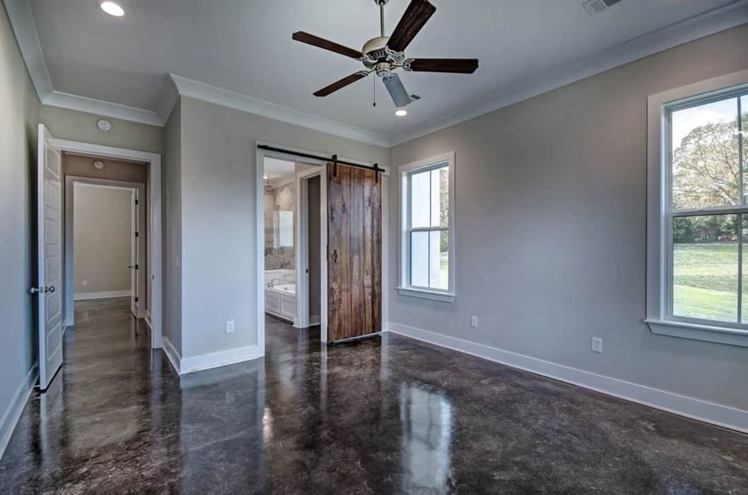 Polished Concrete and a Barn Door That Earns Its Place