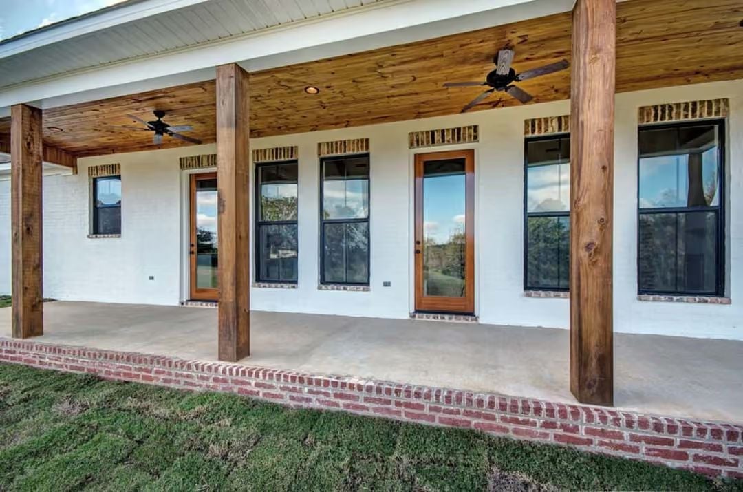 Reclaimed Wood Posts and a Tongue-and-Grove Ceiling Built for Evening Air