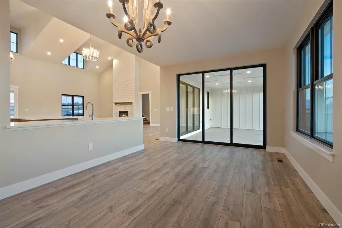 Glass-Walled Office Off the Main Living Area Keeps Work Visible But Contained