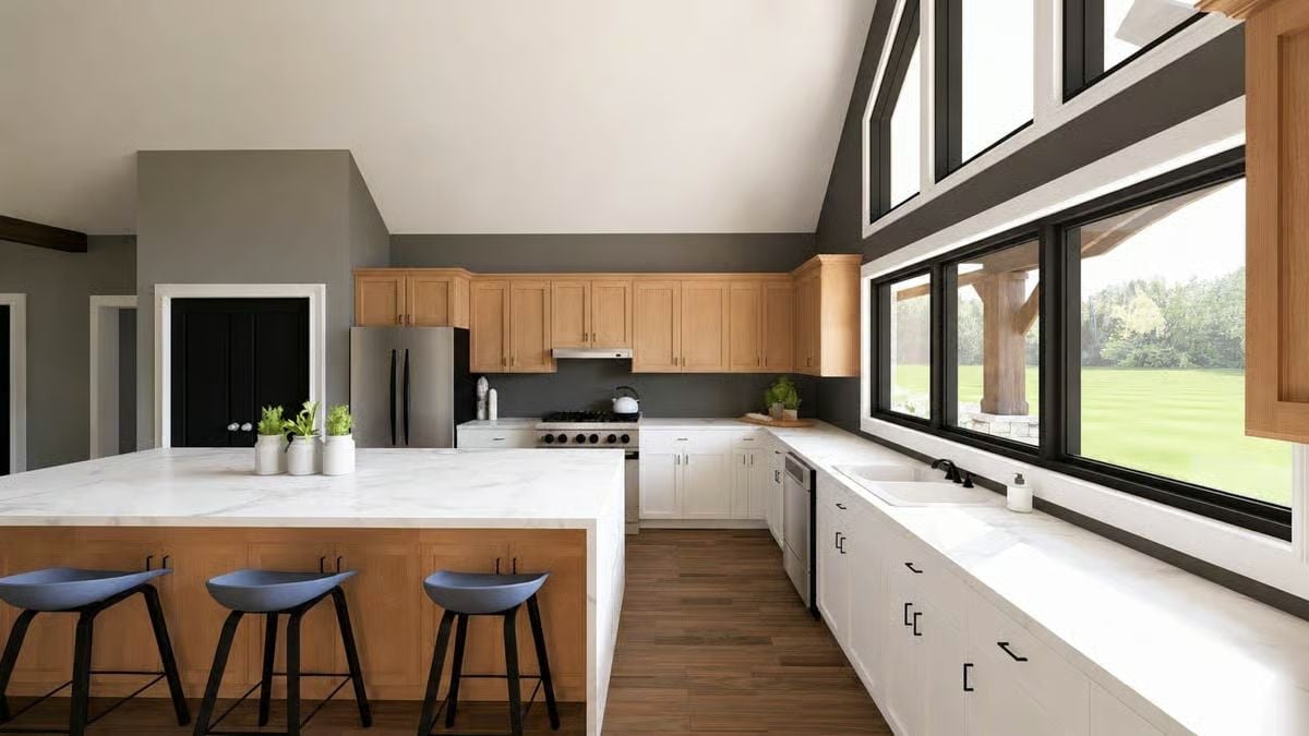 Marble Counters, Two Cabinet Colors, and a Sink That Faces the Yard