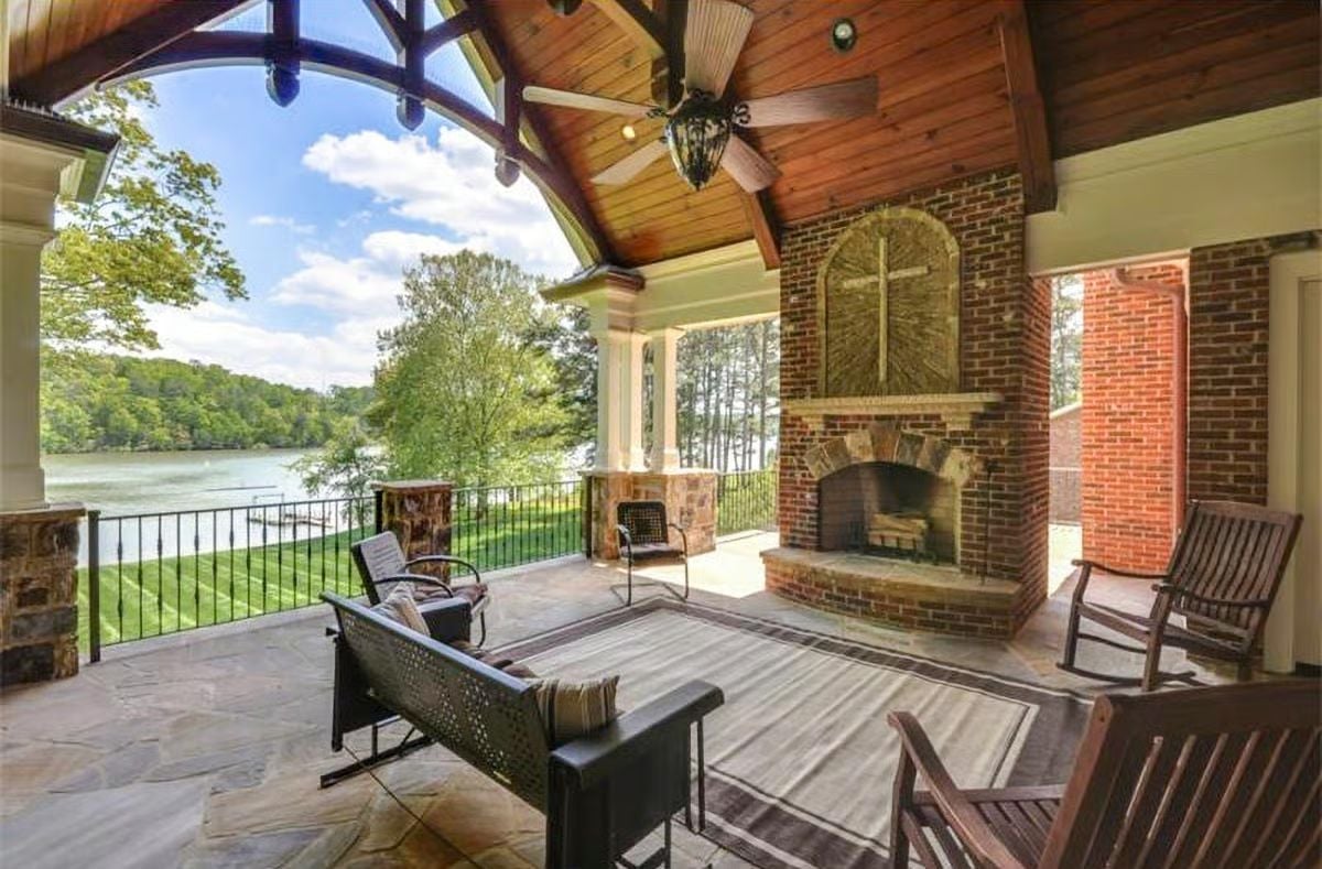 Brick Fireplace, Lake Views, and a Covered Porch Built for Year-Round Living
