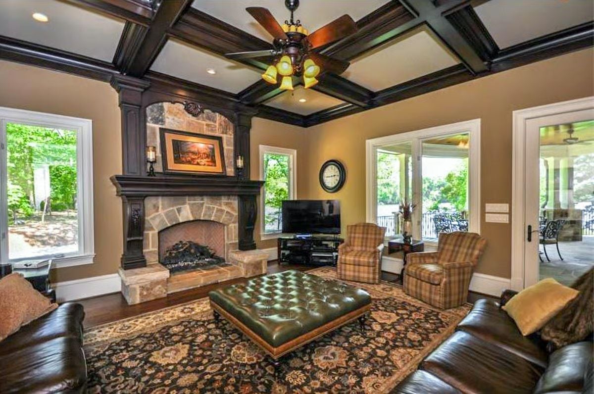 Coffered Ceiling, Stone Fireplace, and Tufted Leather That Pull the Room Together