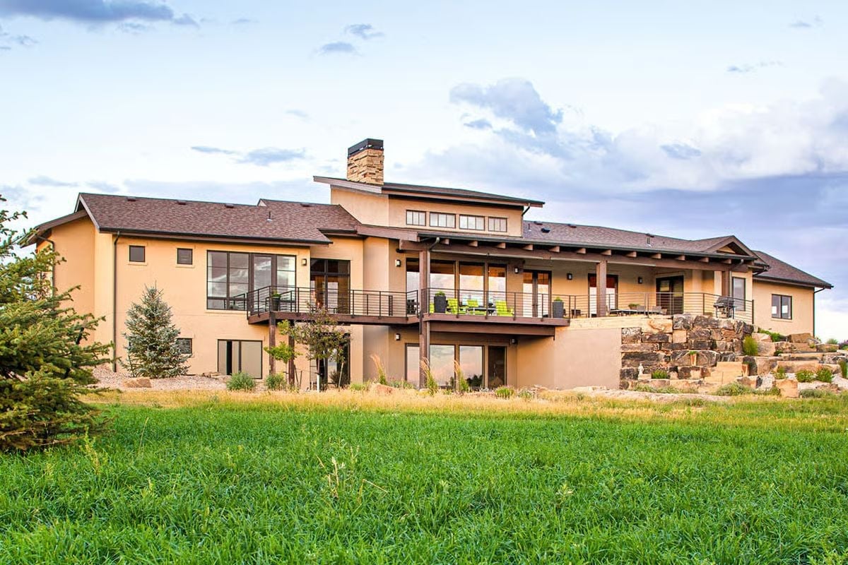 Covered Deck, Stone Steps, and a Backyard That Earns the Drive Out Here