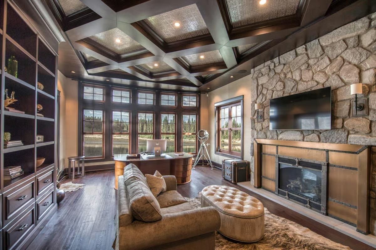 Coffered Ceiling, Stone Fireplace, and a Desk That Belongs in a Study Like This