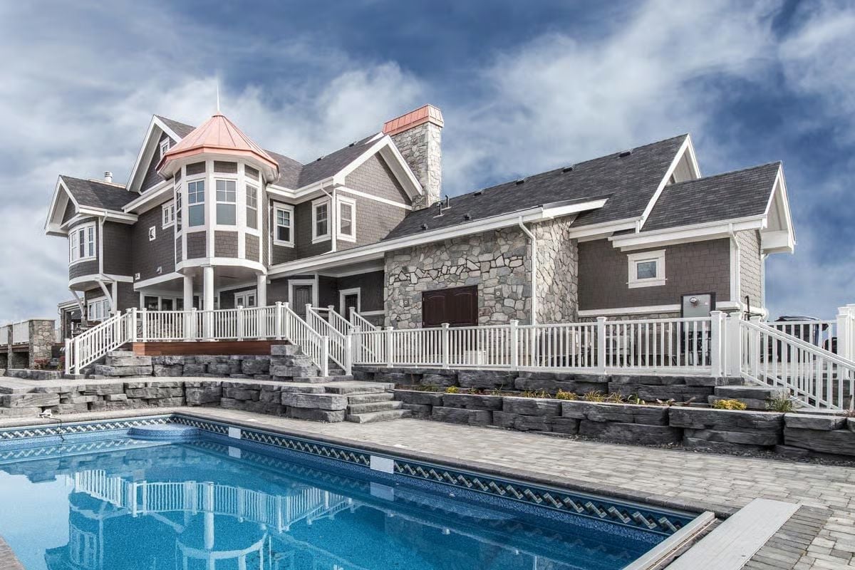 Copper Turret, Stone Veneer, and a Pool Deck Built for Serious Entertaining
