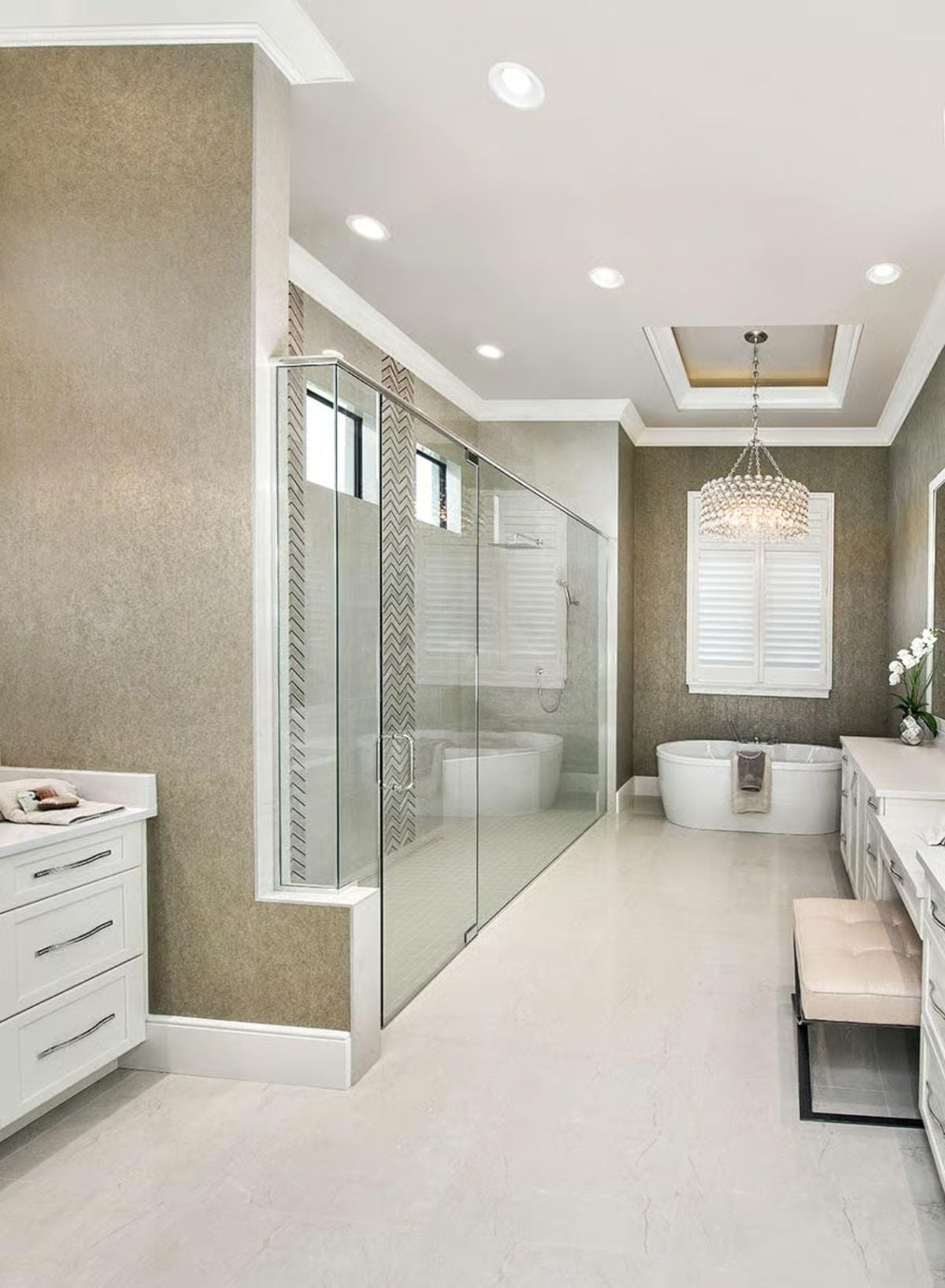Glass Wall Shower, Freestanding Tub, and a Chandelier That Earns Its Place