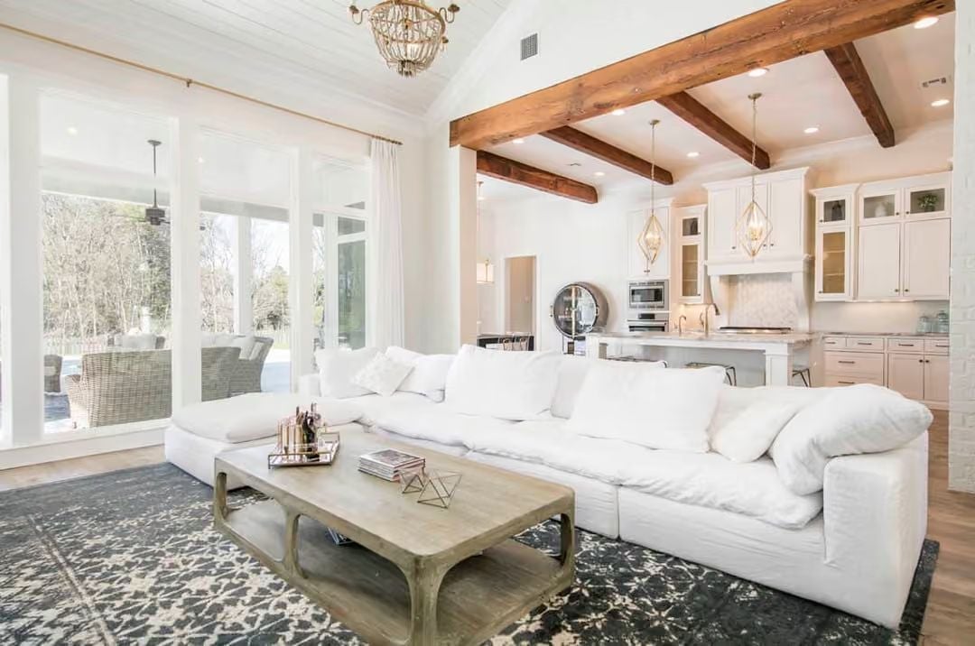 Exposed Beams, Cloud Sofas, and an Open Kitchen That Pulls the Whole Room Together