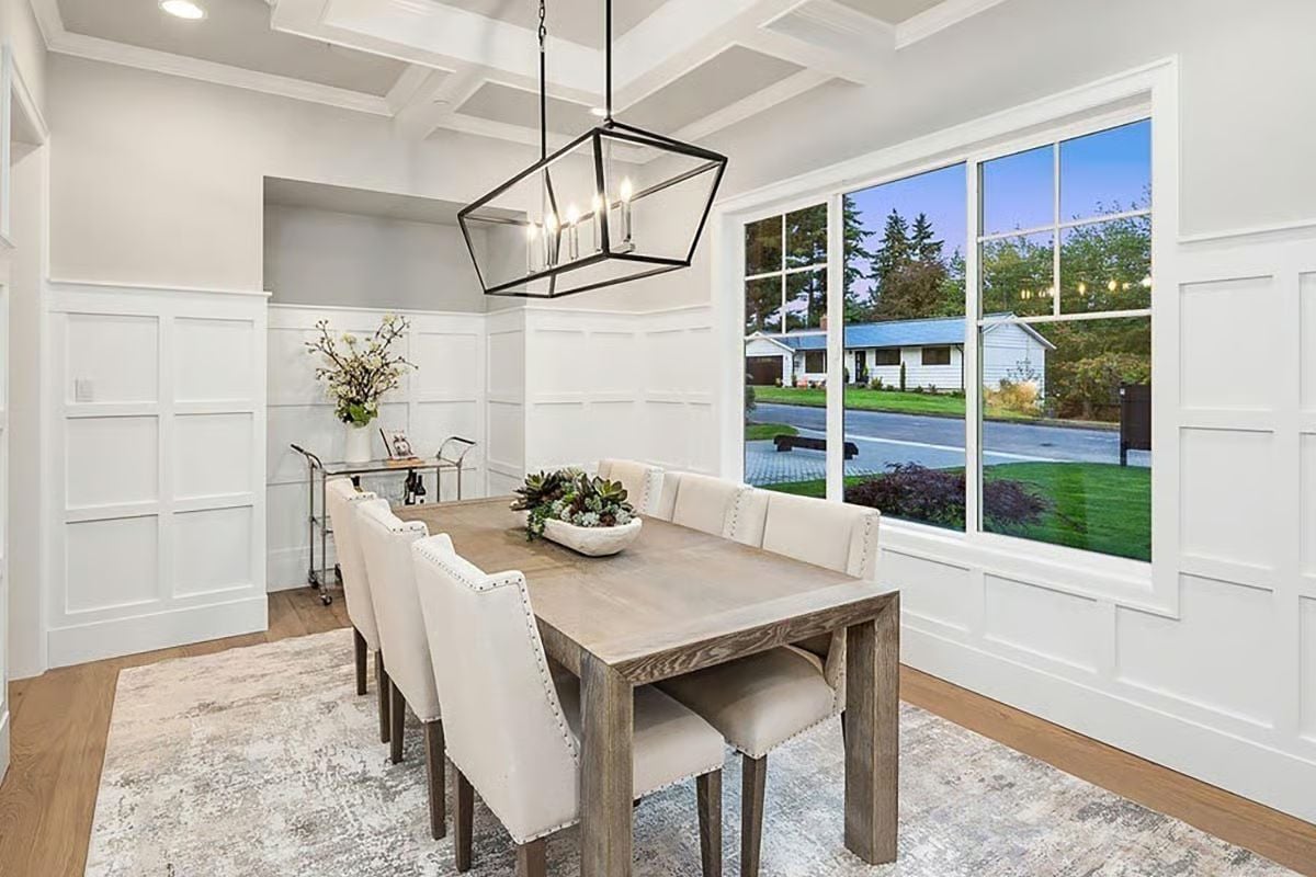 Coffered Ceiling, Cage Pendant, and Wainscoting That Goes All the Way Around