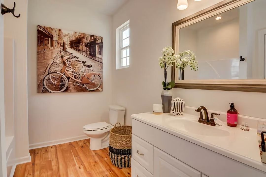 Orchids, a Woven Basket, and a Faucet That Pulls the Whole Vanity Together