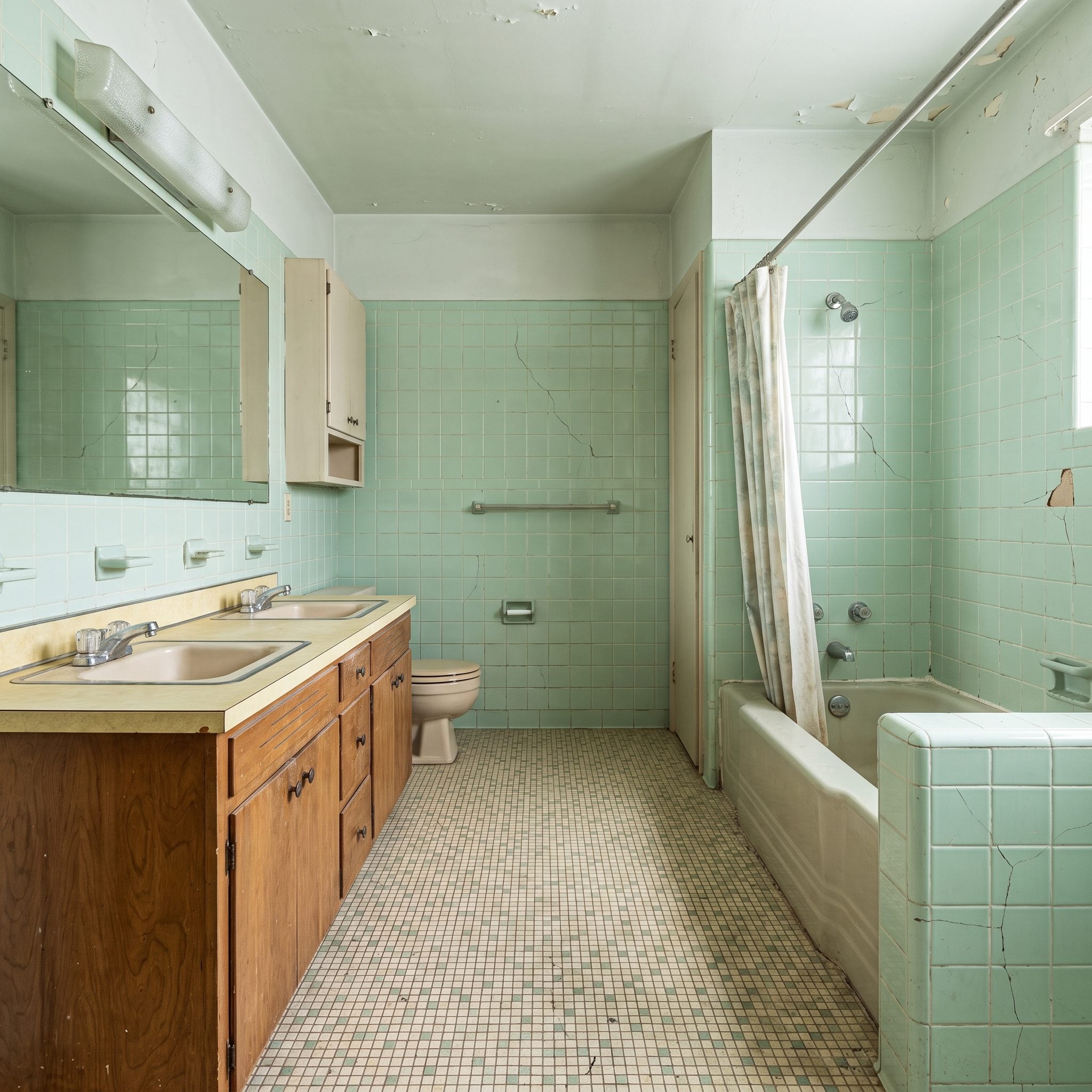 This Cracked-Tile 1960s Bathroom Was the House's Most Neglected Room — Here Are 27 Before & After Designs — Before