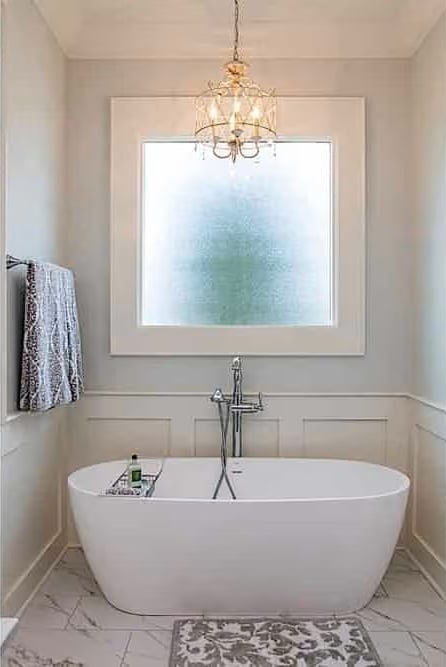 Frosted Glass, Freestanding Tub, and a Chandelier That Has No Business Being This Good