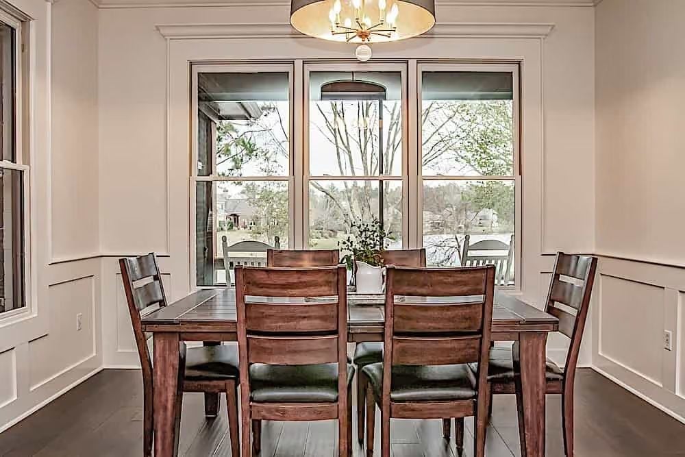 Ladder-Back Chairs, Triple Windows, and Natural Light That Does the Decorating