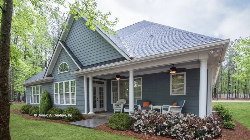 Blue-Gray Siding and White Columns Make a Covered Porch Worth Sitting On