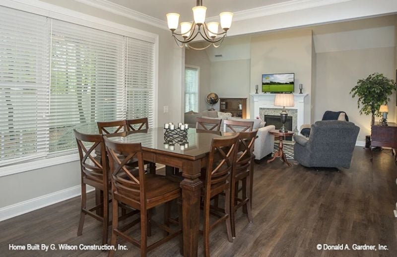 Dark Wood and a Chandelier Make the Dining Room Feel Grown-Up