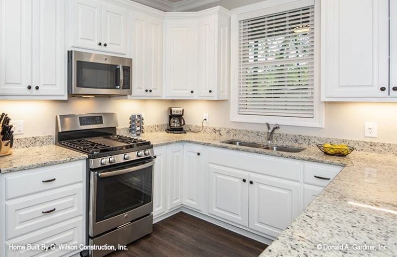 Stainless Appliances and Granite Counters Do the Heavy Lifting Here