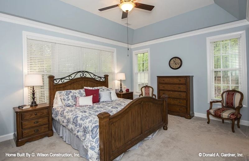 Wrought Iron Scrollwork and Wood Grain Give This Bedroom Real Character