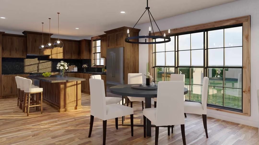Round Table, Dark Stone Top, White Chairs That Don't Try Too Hard