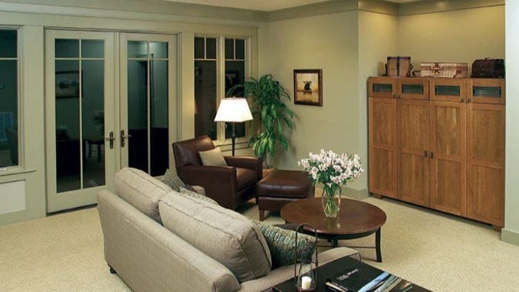 French Doors, Warm Wood, and a Sofa That's Clearly Seen Some Good Conversation