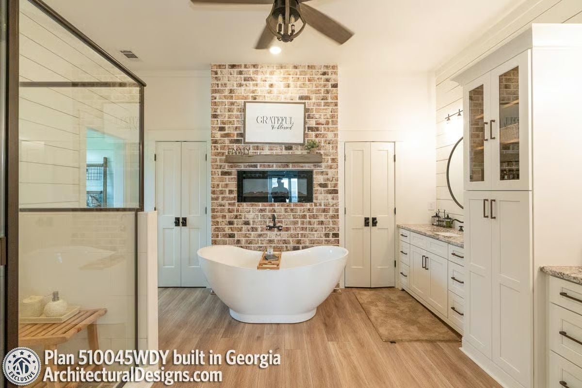 Freestanding Tub Positioned in Front of a Fireplace Because Why Not