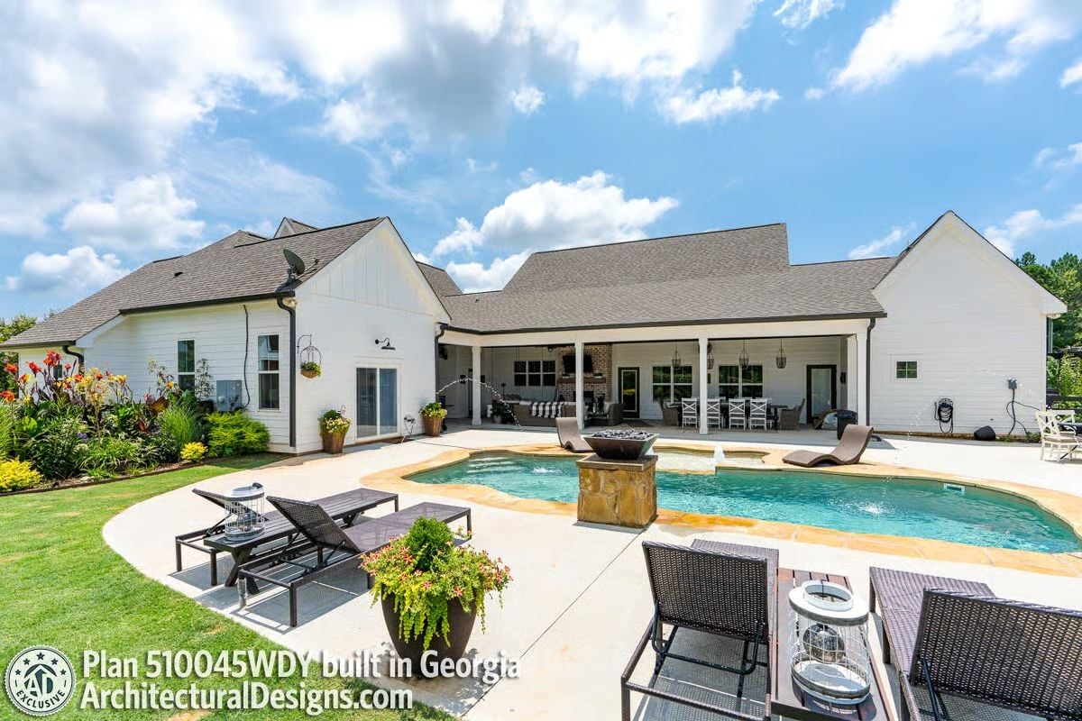 Kidney-Shaped Pool and Stone Water Feature That Earn Their Keep Out Back
