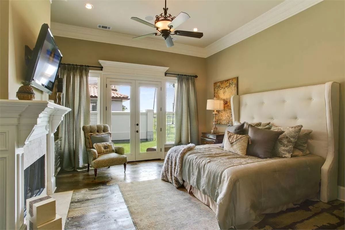 Tufted Headboard and French Doors to the Yard Make This Bedroom Hard to Leave