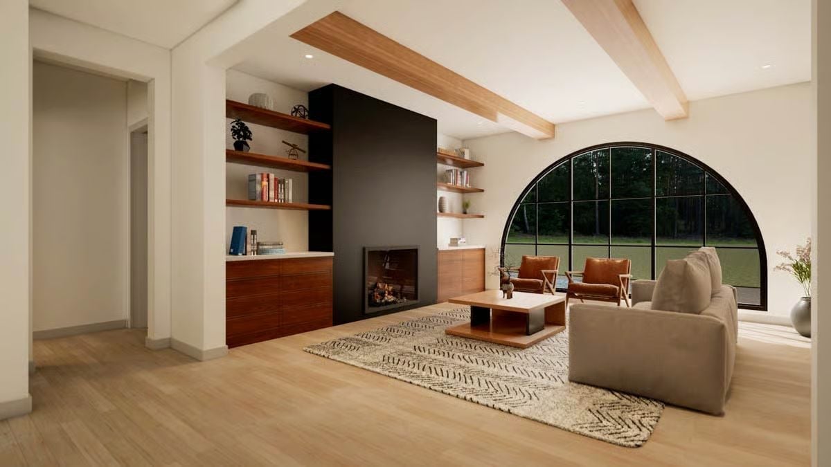 Exposed Beams, a Black Fireplace Surround, and That Arch Window Do the Heavy Lifting