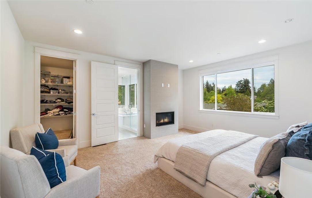 Fireplace, Walk-In, and an Ensuite Visible Through Frosted Glass