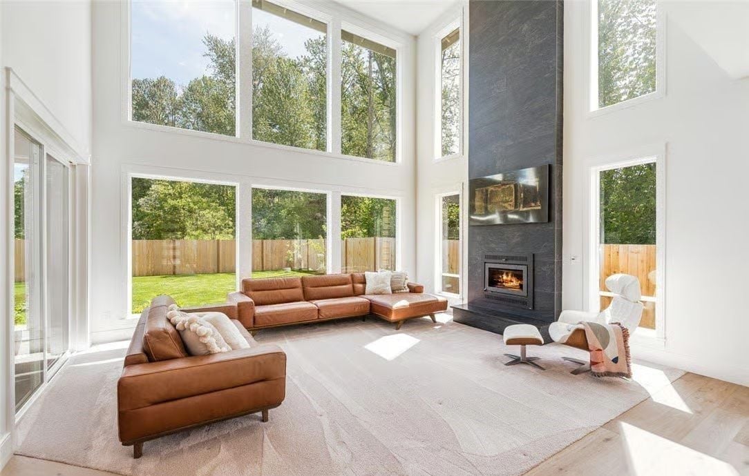 Leather, Slate, and a Two-Story Fireplace Wall That Earns Every Inch