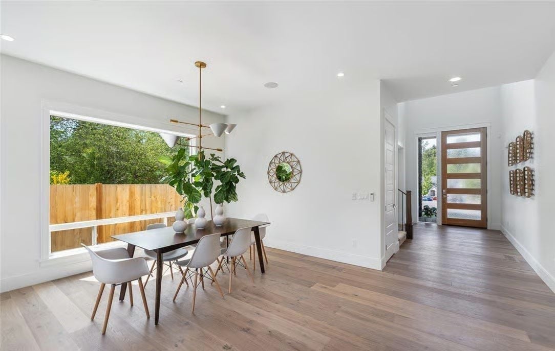 Midcentury Dining Furniture Hits Different Against White Walls and Wide-Plank Oak