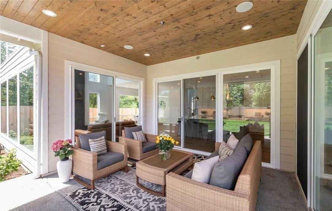 Wood Ceiling, Wicker, and Sliding Glass That Connects Three Spaces at Once
