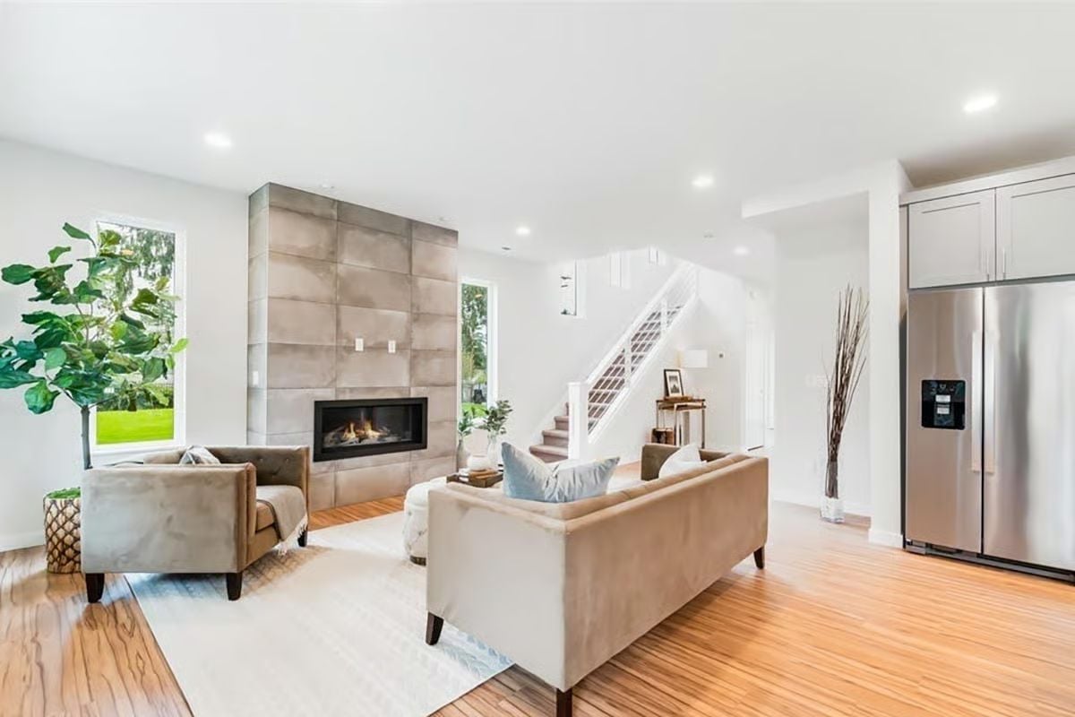 Floor-to-Ceiling Tile Surround Turns a Linear Fireplace Into the Room's Anchor