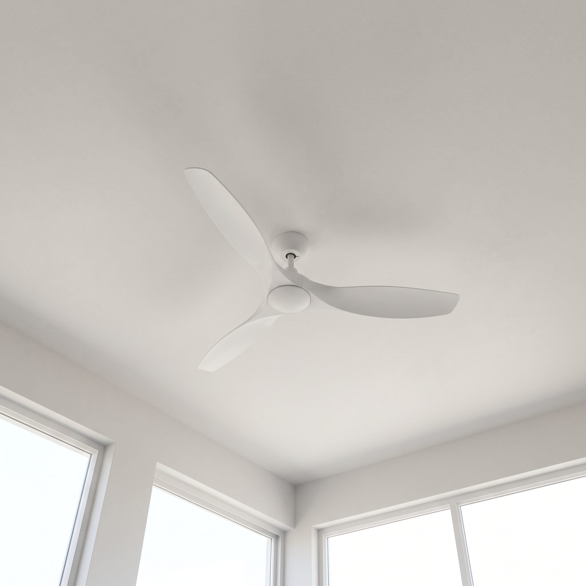 Living room with a three-blade matte black ceiling fan and no light kit mounted at the center of a white nine-foot ceiling,