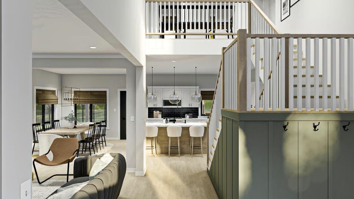 Green Mudroom Wall and Open Staircase Make an Entrance Worth Walking Into