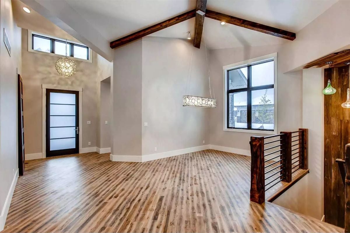 Exposed Beams, Vaulted Ceilings, and a Staircase Rail That Steals the Show
