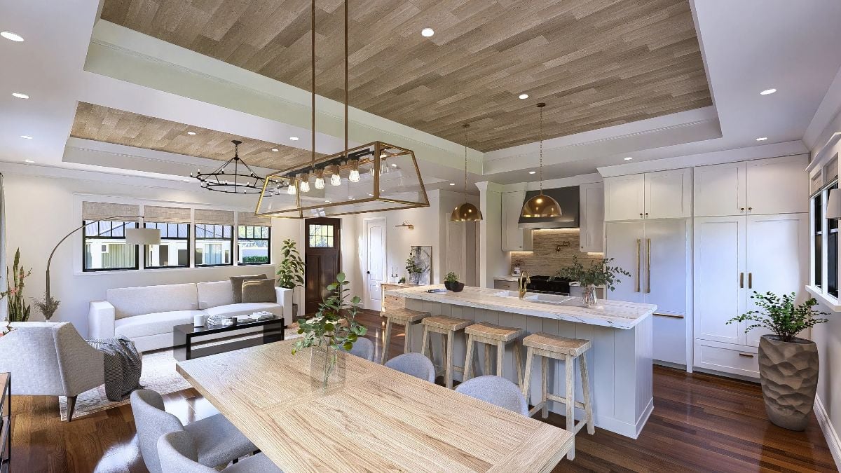 Gold Pendants and Rattan Stools Ground This Open Kitchen Without Closing It Off