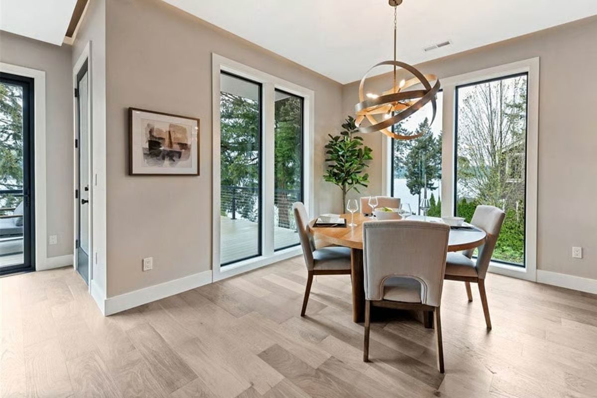 Gold Orbital Chandelier, Round Table, and a Water View Nobody Warned You About