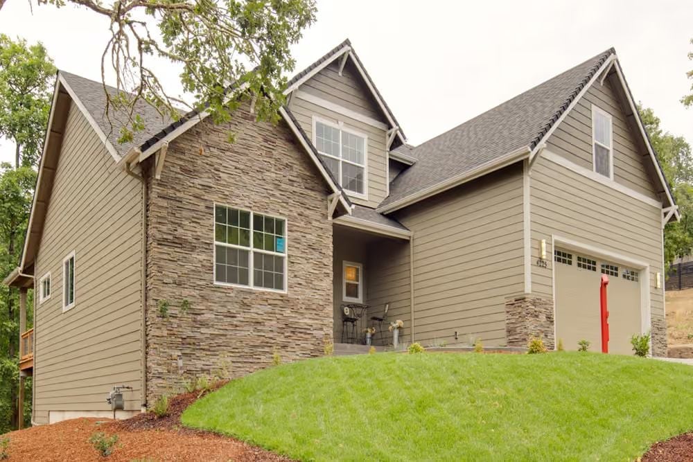 Stone Veneer on the Front Facade Does More Work Than Most Siding Ever Could