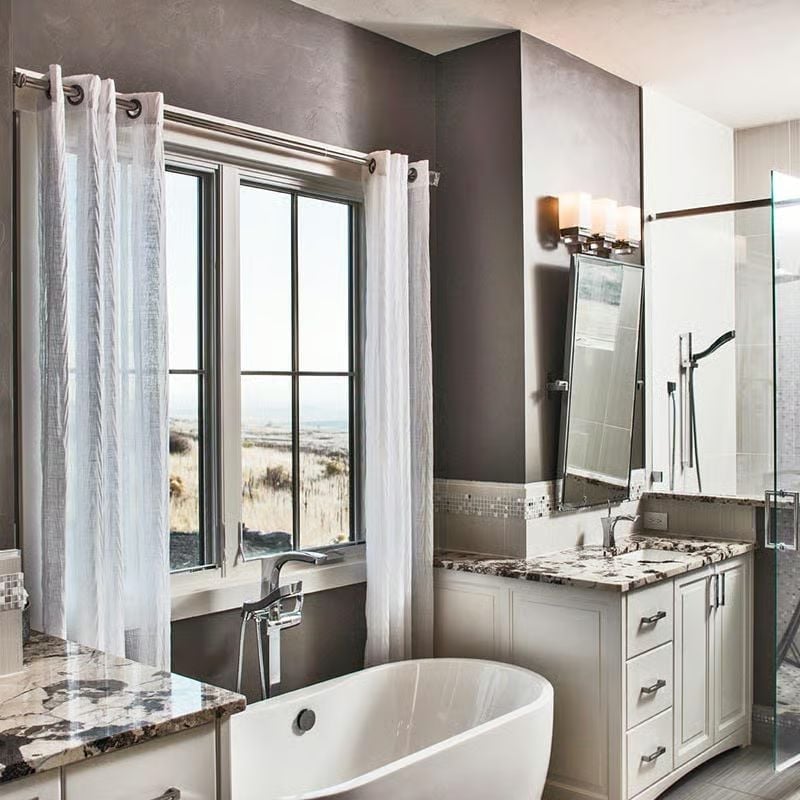Freestanding Soaking Tub Positioned to Catch the Grassland View
