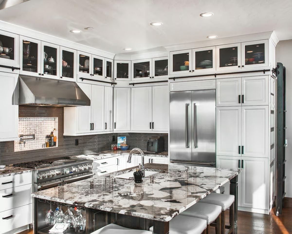 Granite Island with a Wine Glass Rack Underneath Says Everything About Priorities