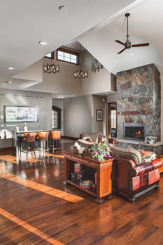 Vaulted Stone Fireplace Anchors an Open Living Space Built to Breathe
