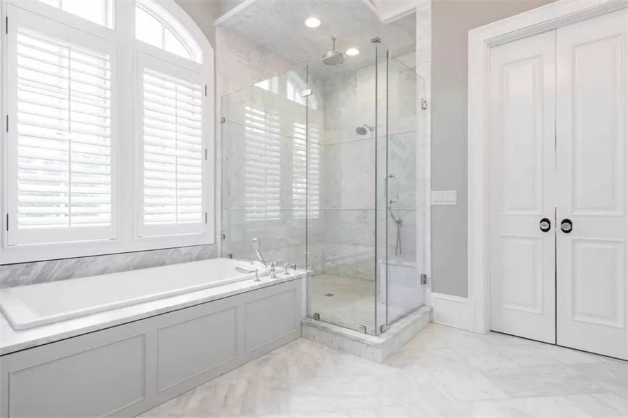 Marble Shower, Rain Head, and a Soaking Tub That Doesn't Share Its Window