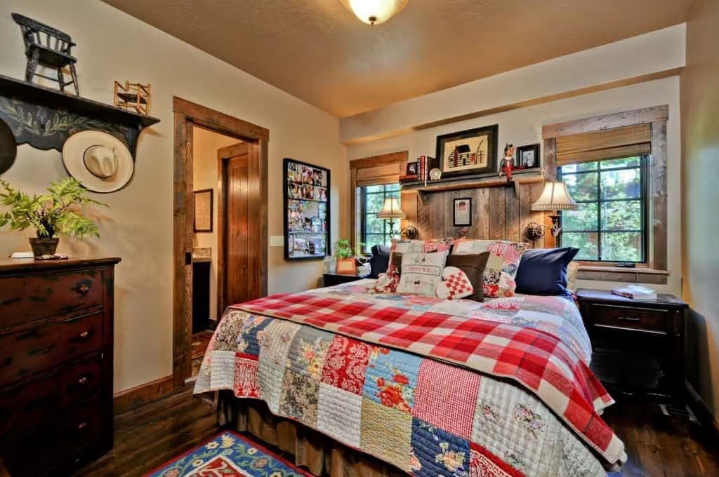 Patchwork Quilt and Reclaimed Wood Headboard Wall Set the Whole Tone Here