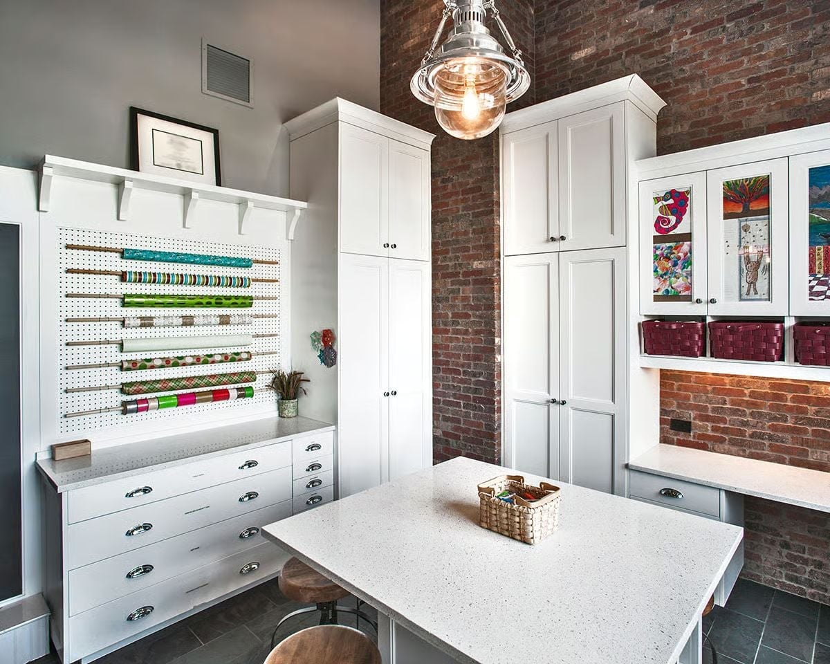 Pegboard, Wrapping Rolls, and Flat-File Drawers Built Into One Craft Wall