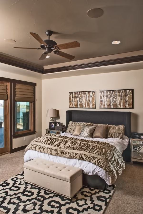 Dark Upholstered Headboard Anchoring a Room Built Around Warmth