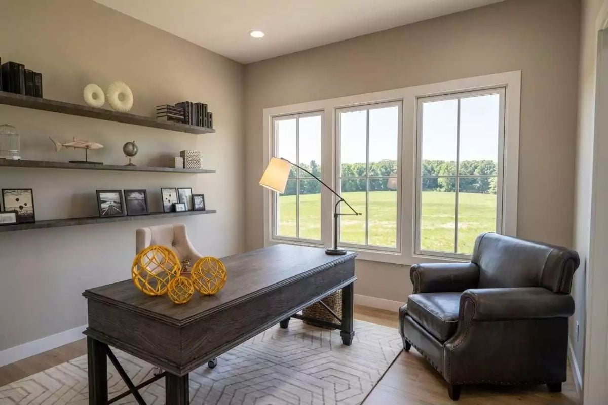 Floating Shelves, a Leather Club Chair, and a View Worth Sitting Toward
