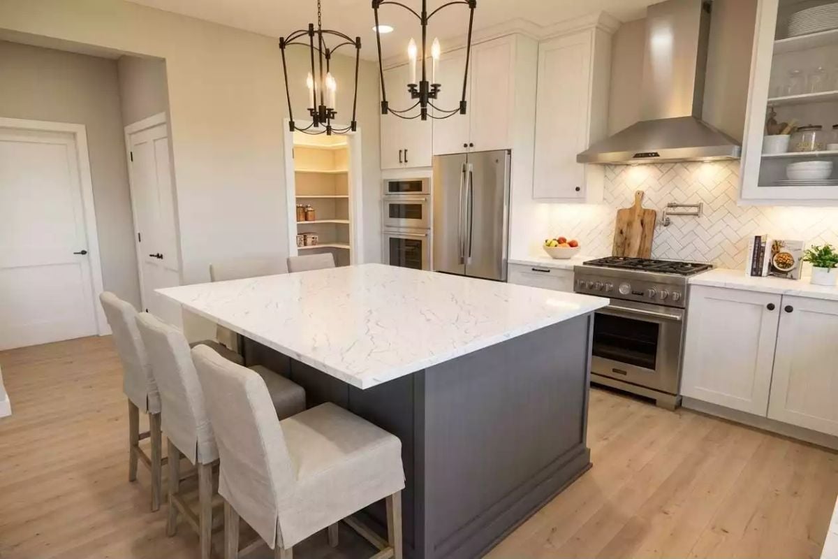 Gray Island Base Against White Cabinetry Is a Pairing That Earns Its Keep